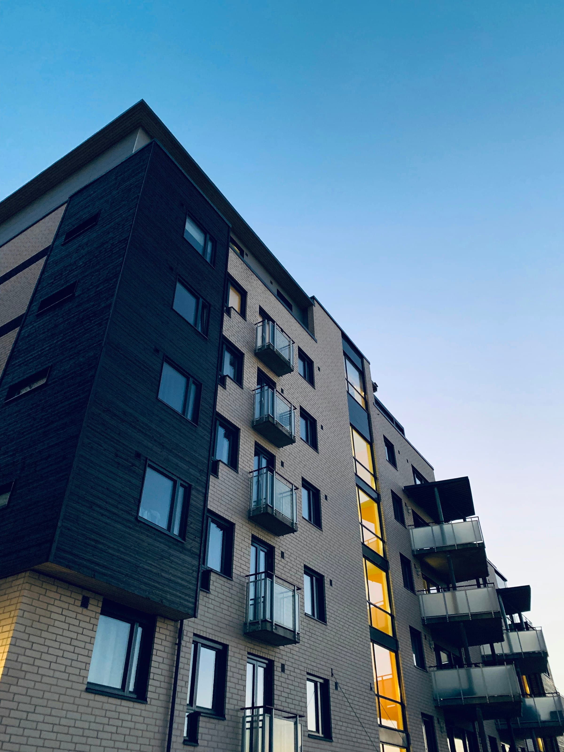 Modern multifamily facade — representative of the income-producing assets we arrange financing for